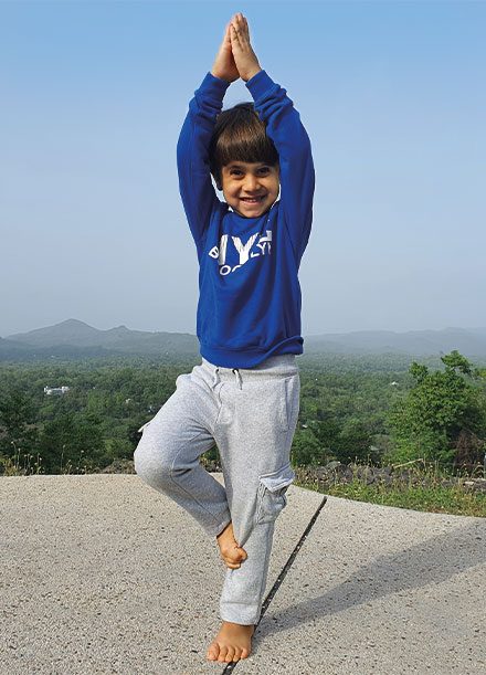 A Child in Vrukshasana